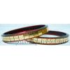 KKLK01029 A pair of acrylic bangles/bracelete with golden bricks handiwork.