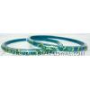 KKLK01033 Pair of turquoise acrylic bangles with inlined fabric handiwork.