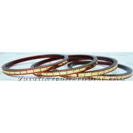 KKLK01030 A set of 4 acrylic bangles with golden bricks handiwork.